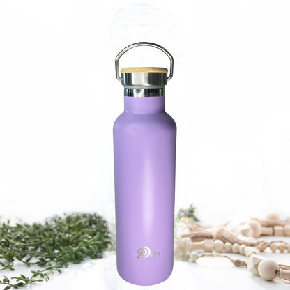 A purple stainless steel insulated water bottle with a bamboo lid, handle at top, and displaying the brand PPD on the front. The bottle is shown against a neutral background with a plant and decorative elements to the side.