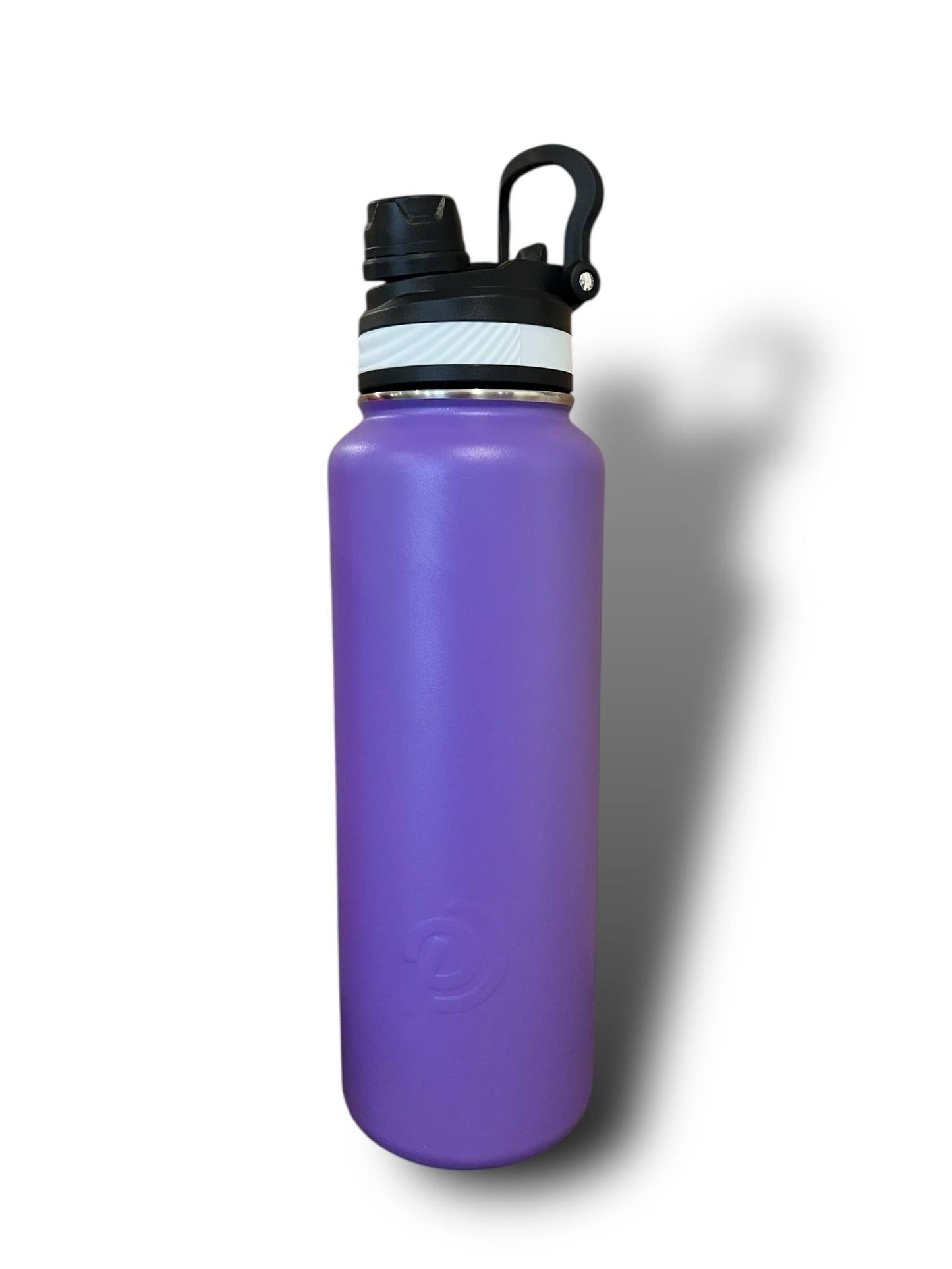 Purple water bottle with black cap on a white background