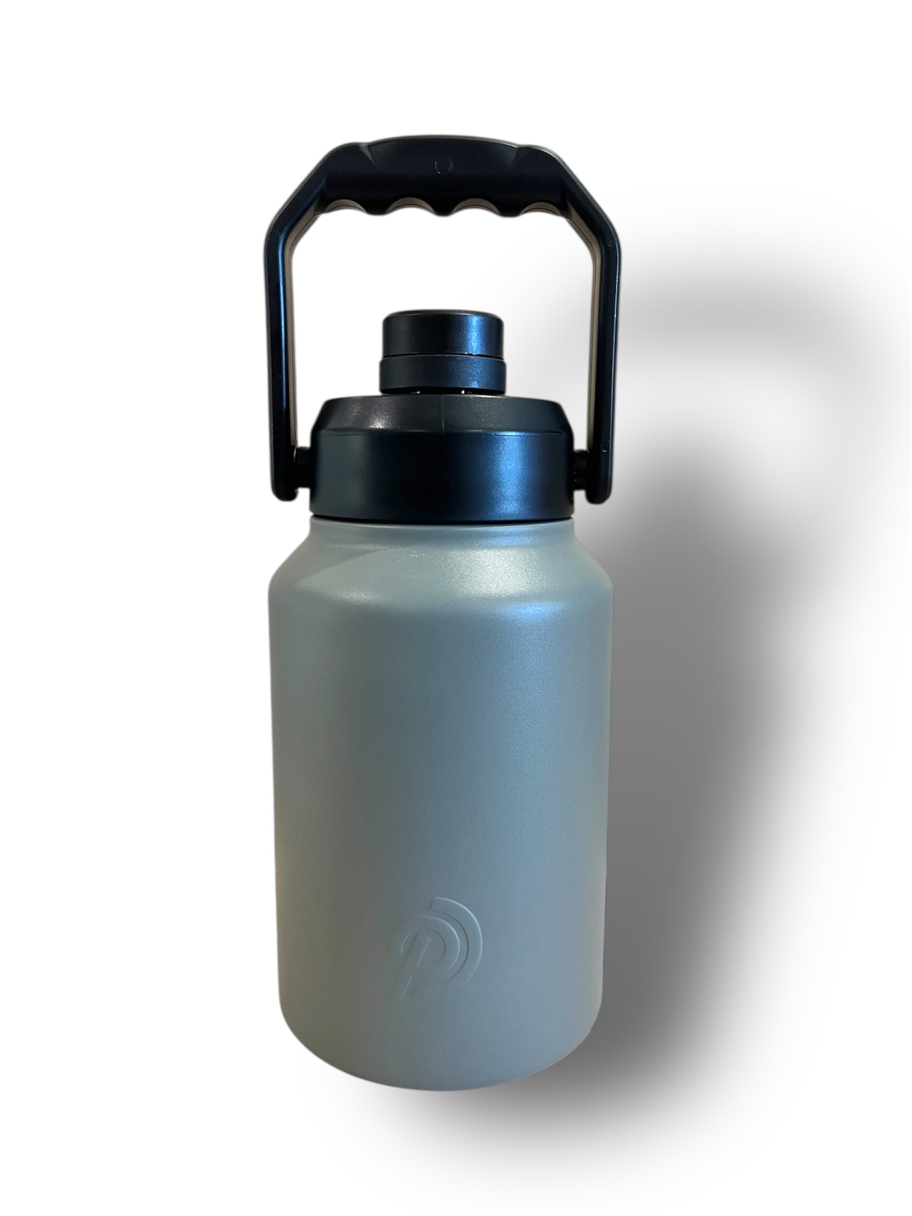 Large water bottle with a black handle on a white background